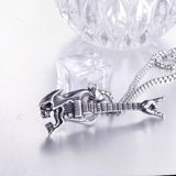 Collier pendentif Johnny Hallyday - Guitare tête de mort | Johnny Hallyday Fanclub
